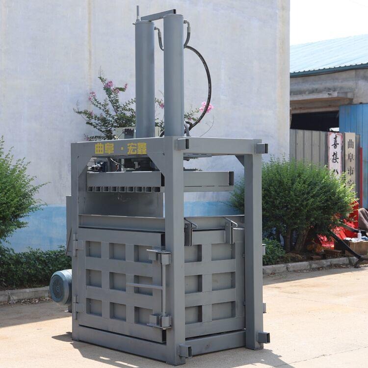 碎布料液压打包机视频 定做油漆桶压扁机 60吨铁桶油漆桶压扁机