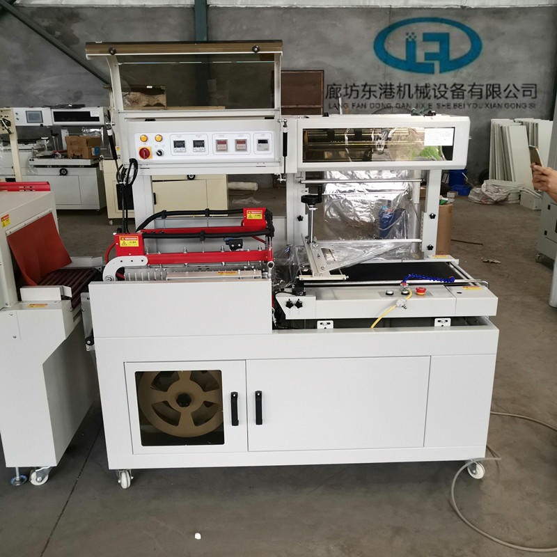 东港 热收缩机 L450型热收缩机 消毒餐具热收缩机 免费测试包装图片